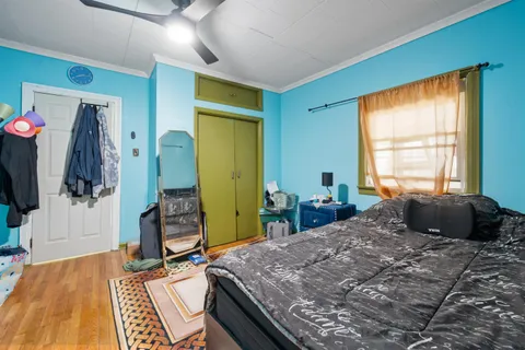 a bed room with bed and a window