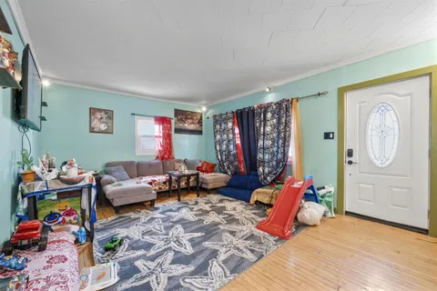 a bedroom with two beds and a lamp