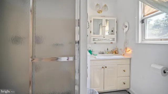 a view of cabinets and a window in the kitchen
