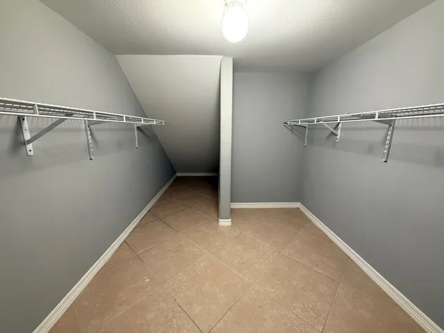 a view of a patio with a table chairs and a backyard