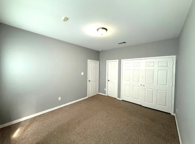 a bathroom with a sink mirror and toilet
