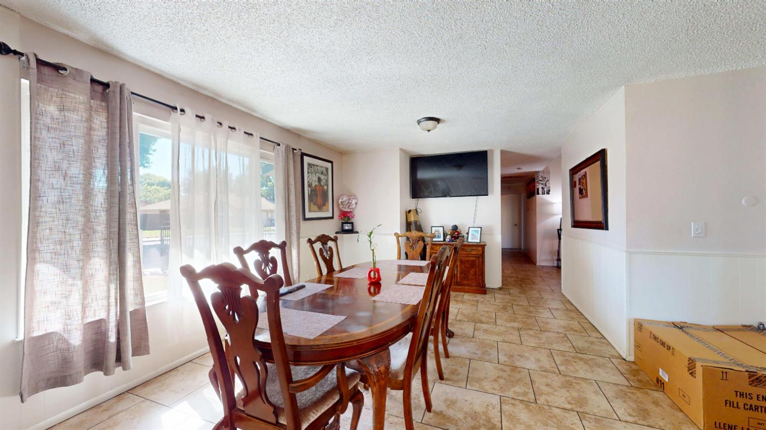 4005 Honey Creek Road Modesto, CA 95356 - Photo 11 of 25 a view of a dining room with furniture and a window