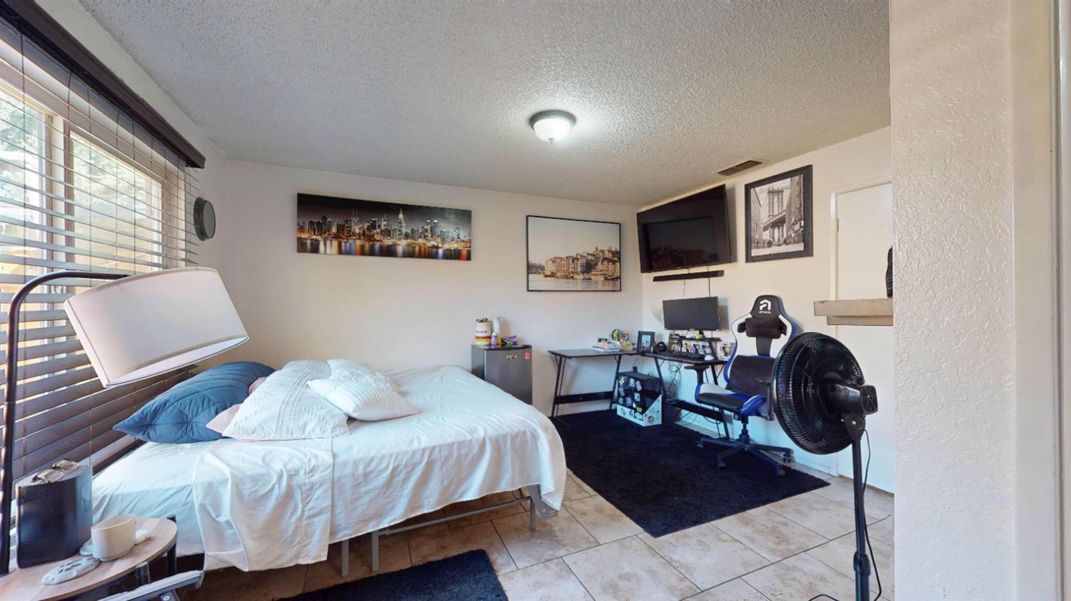 4005 Honey Creek Road Modesto, CA 95356 - Photo 14 of 25 a bedroom with a bed and a chair