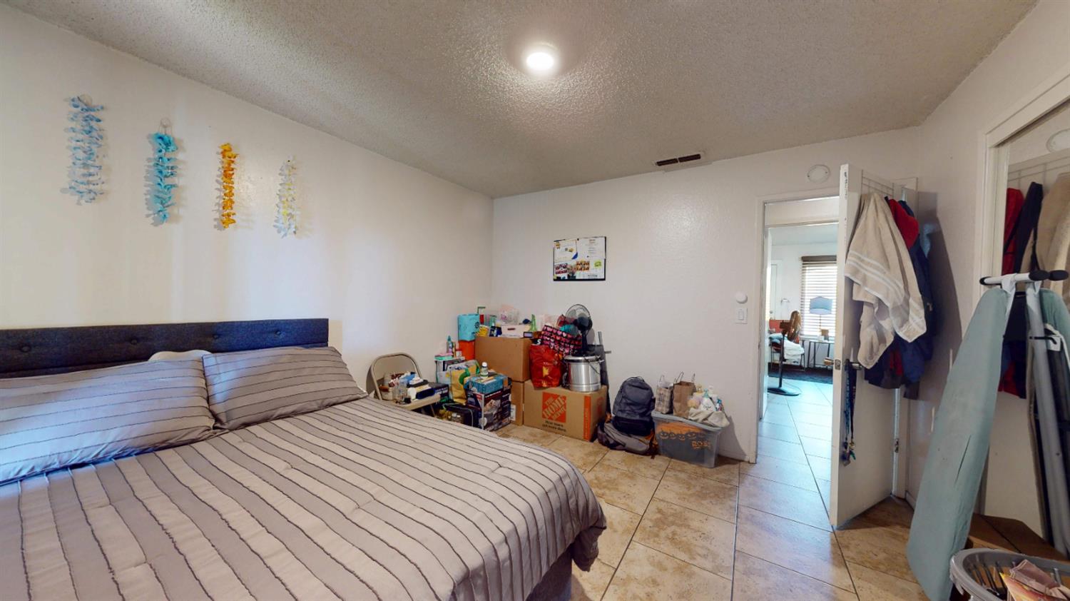 4005 Honey Creek Road Modesto, CA 95356 - Photo 15 of 25 a bedroom with bed and a wooden floor