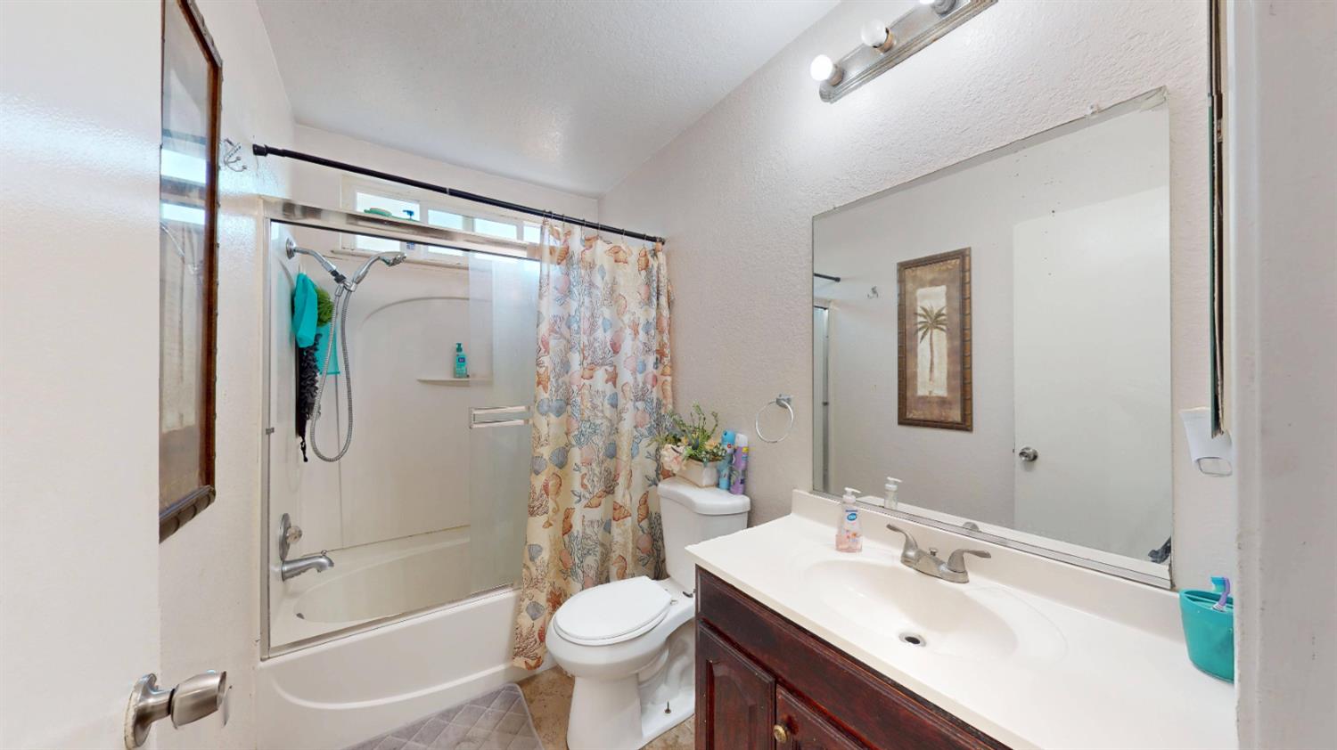 4005 Honey Creek Road Modesto, CA 95356 - Photo 18 of 25 a bathroom with a sink toilet and shower
