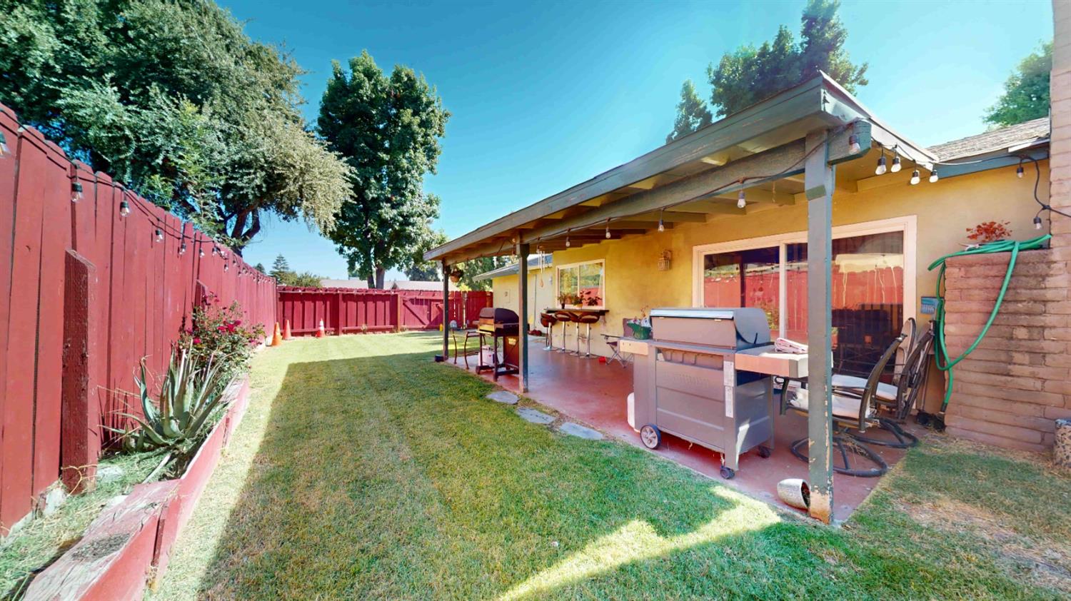 4005 Honey Creek Road Modesto, CA 95356 - Photo 22 of 25 a view of a backyard with a patio