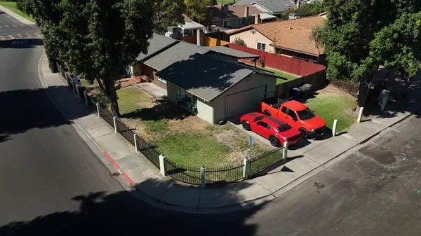 an aerial view of residential house with outdoor space