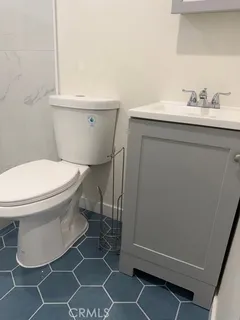 a bathroom with a toilet and a sink