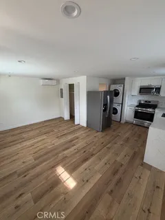 a view of a livingroom with wooden floor