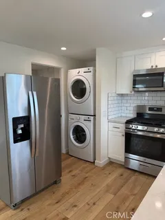 a view of a kitchen with washer and dryer