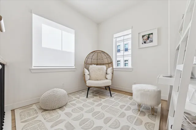 a bedroom with a bed and a chair