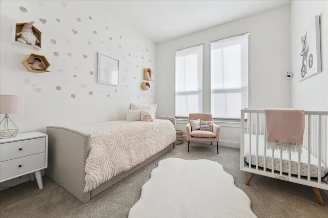 a bedroom with a bed and a couch