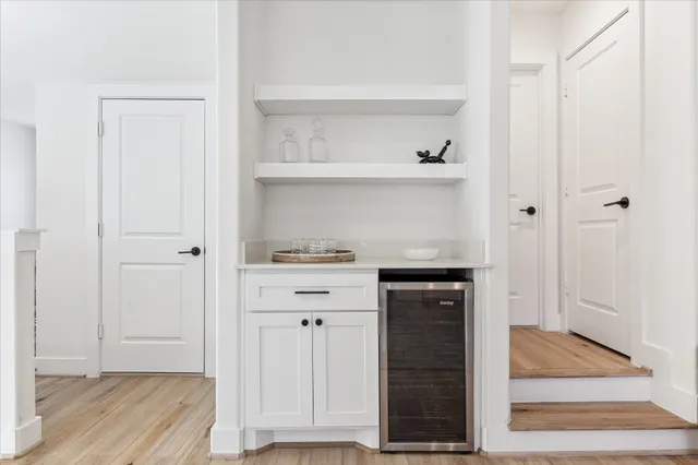 a view of cabinets and wooden floor