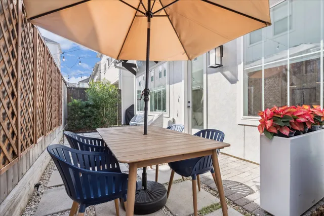 a view of balcony with table and chairs