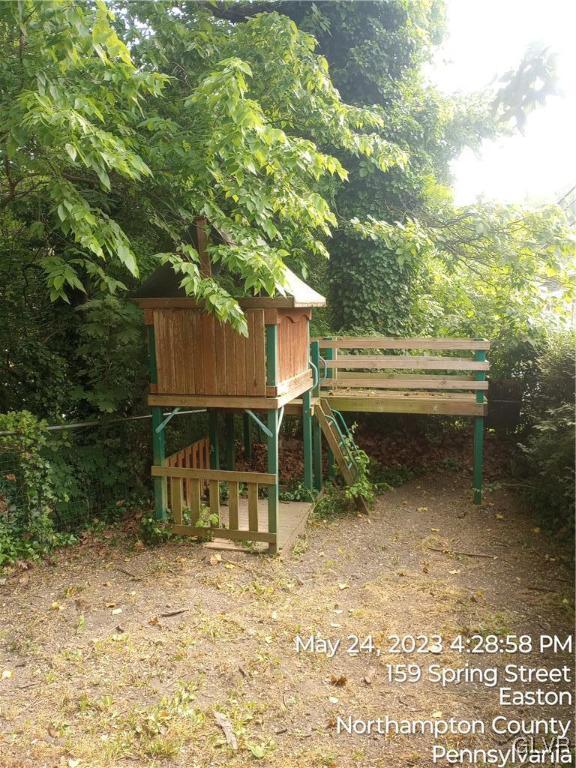 160 Spring Street Easton, PA 18042 - Photo 13 of 35 a backyard of a house with barbeque oven table and chairs