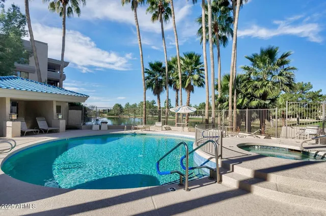 a lake view with a table and chairs