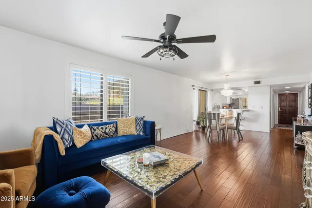 a living room with furniture and a table