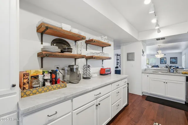a kitchen with cabinets and window
