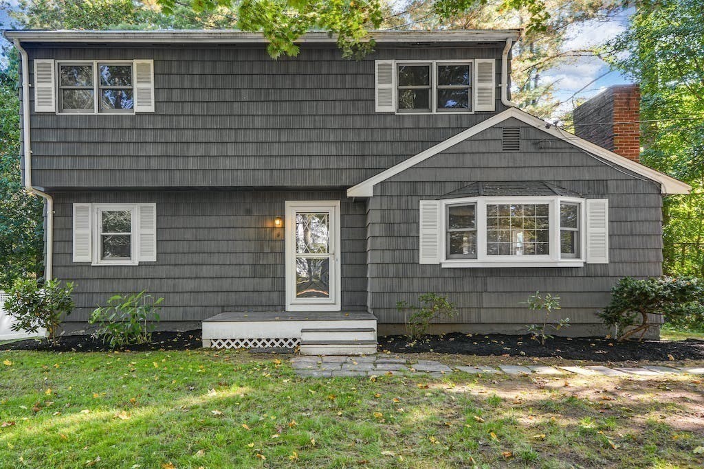 30 Old Marlboro Road Maynard, MA 01754 - Photo 1 of 34 a front view of a house with a yard
