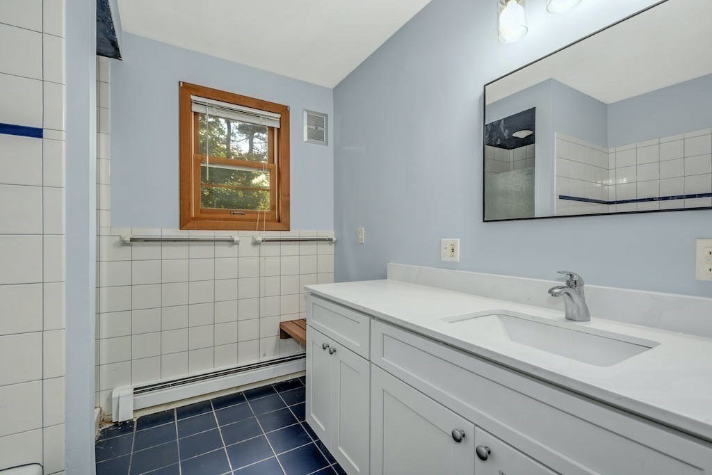 30 Old Marlboro Road Maynard, MA 01754 - Photo 15 of 34 a bathroom with a sink toilet and vanity