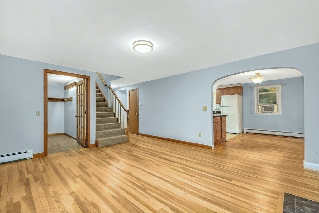 30 Old Marlboro Road Maynard, MA 01754 - Photo 2 of 34 an empty room with wooden floor and windows
