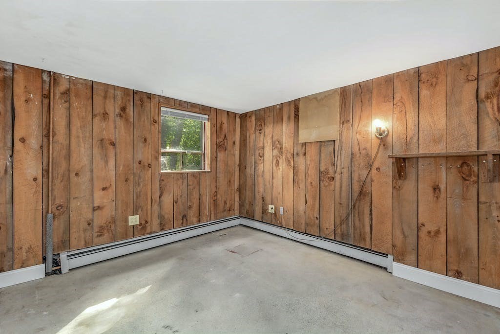 30 Old Marlboro Road Maynard, MA 01754 - Photo 23 of 34 a view of an empty room with wooden walls