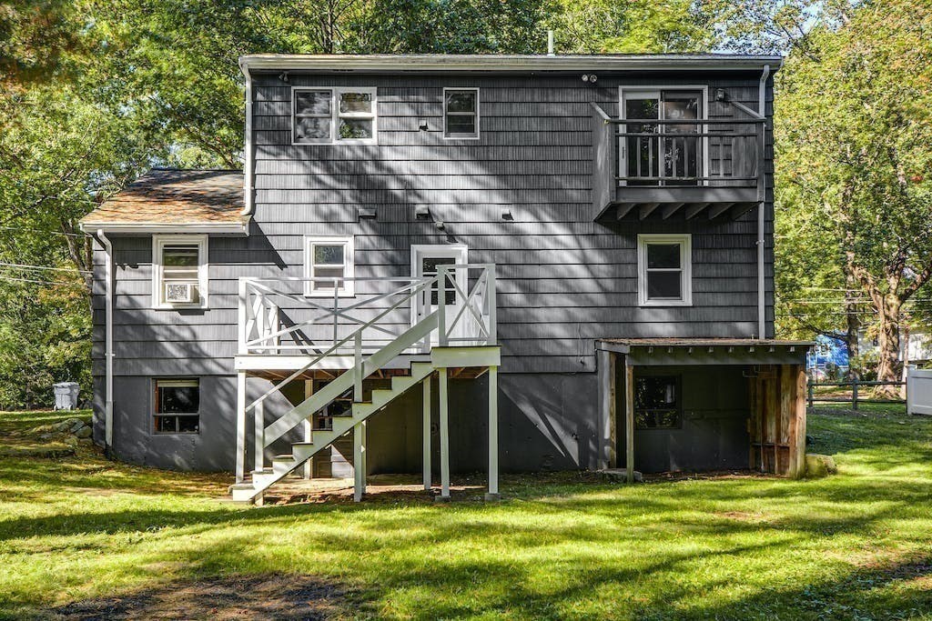 30 Old Marlboro Road Maynard, MA 01754 - Photo 29 of 34 a view of a house with yard and a tree