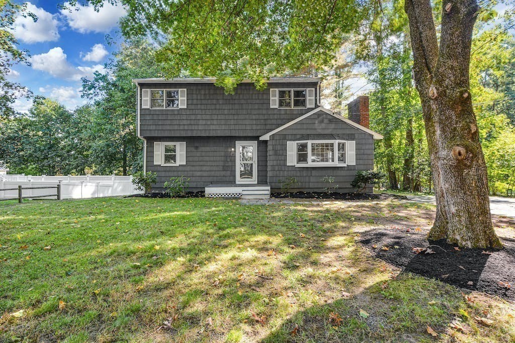 30 Old Marlboro Road Maynard, MA 01754 - Photo 3 of 34 a front view of a house with a garden
