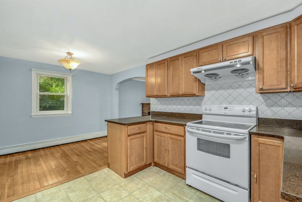 30 Old Marlboro Road Maynard, MA 01754 - Photo 10 of 34 a kitchen with a stove cabinets and a sink