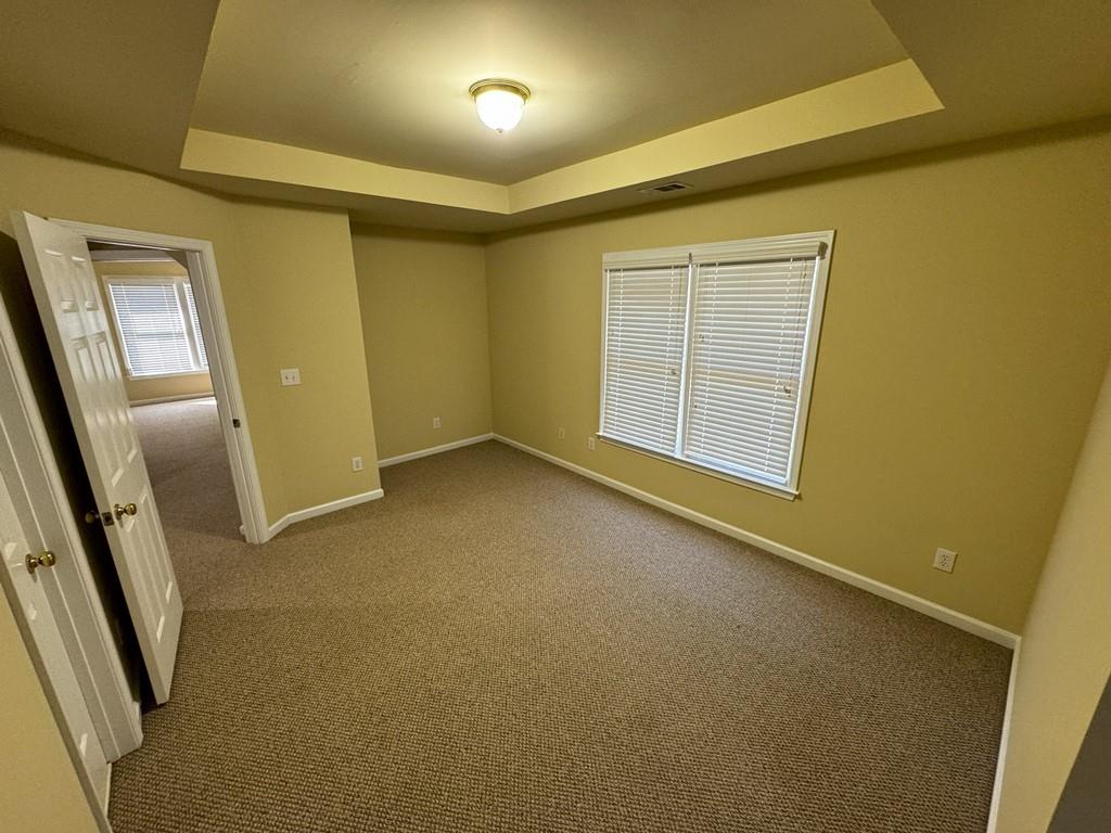 2620 Springmonte Place Cumming, GA 30041 - Photo 29 of 67 an empty room with windows