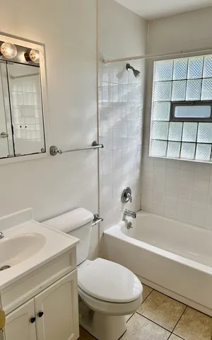 a bathroom with a toilet a sink and bathtub