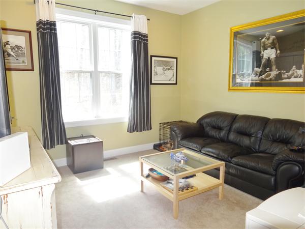 34 Draper Woods Road Sturbridge, MA 01518 - Photo 15 of 27 a living room with furniture and a window
