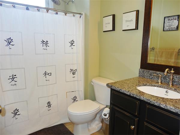 34 Draper Woods Road Sturbridge, MA 01518 - Photo 16 of 27 a bathroom with a granite countertop sink toilet and painting on the wall