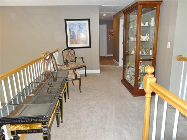 34 Draper Woods Road Sturbridge, MA 01518 - Photo 17 of 27 a view of an entryway with wooden floor and windows