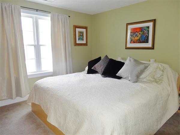 34 Draper Woods Road Sturbridge, MA 01518 - Photo 18 of 27 a bedroom with a bed and a window