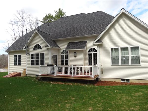 34 Draper Woods Road Sturbridge, MA 01518 - Photo 23 of 27 a front view of a house with a yard