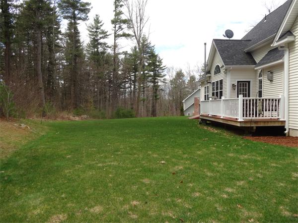 34 Draper Woods Road Sturbridge, MA 01518 - Photo 24 of 27 a view of a house with a yard