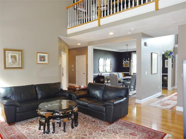 34 Draper Woods Road Sturbridge, MA 01518 - Photo 6 of 27 a living room with furniture and a wooden floor