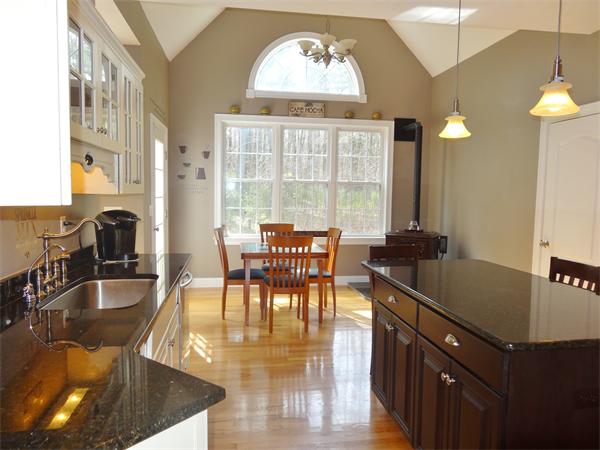 34 Draper Woods Road Sturbridge, MA 01518 - Photo 8 of 27 a view of a dining room with furniture window and outside view