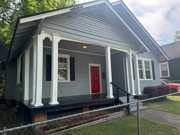 a front view of house with street