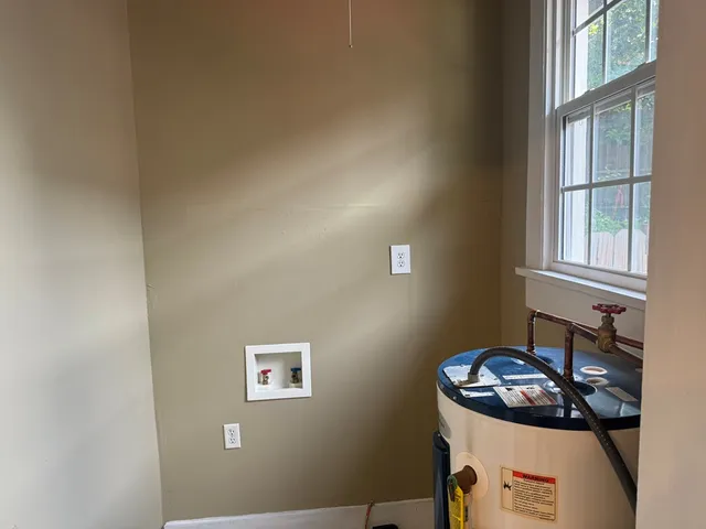 a bathroom with a sink and a window