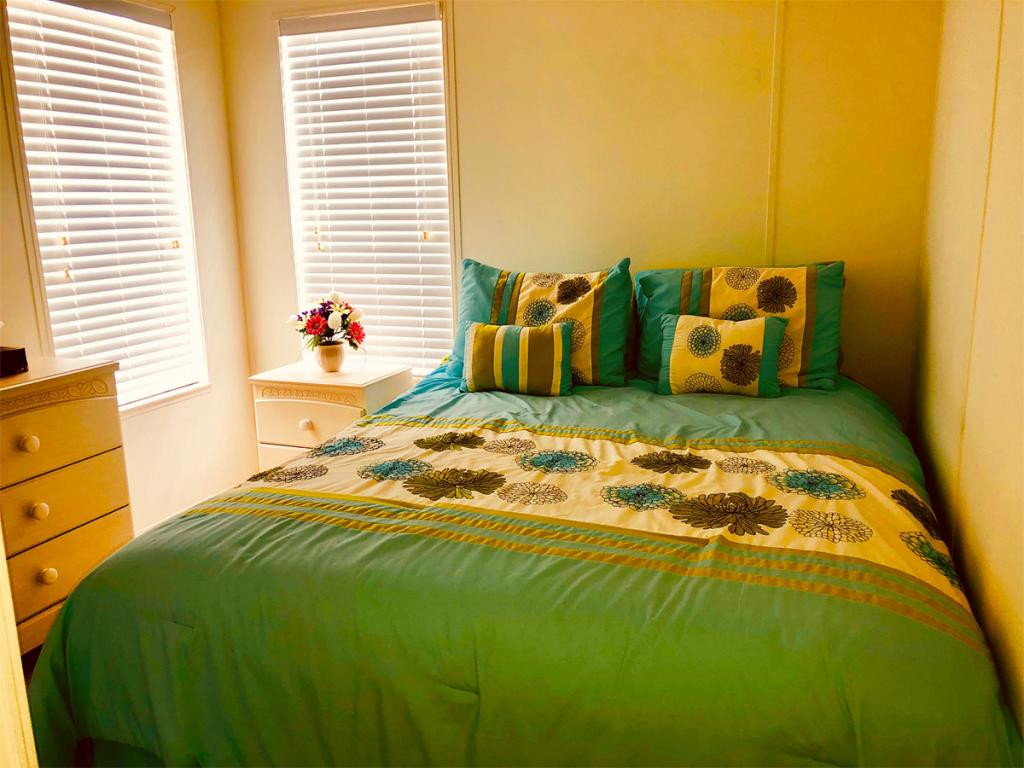 57 Temple Lane Naples, FL 34114 - Photo 11 of 18 a bedroom with bed and window