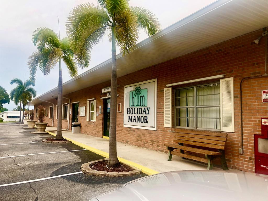 57 Temple Lane Naples, FL 34114 - Photo 14 of 18 a backyard of a house with barbeque oven table and chairs
