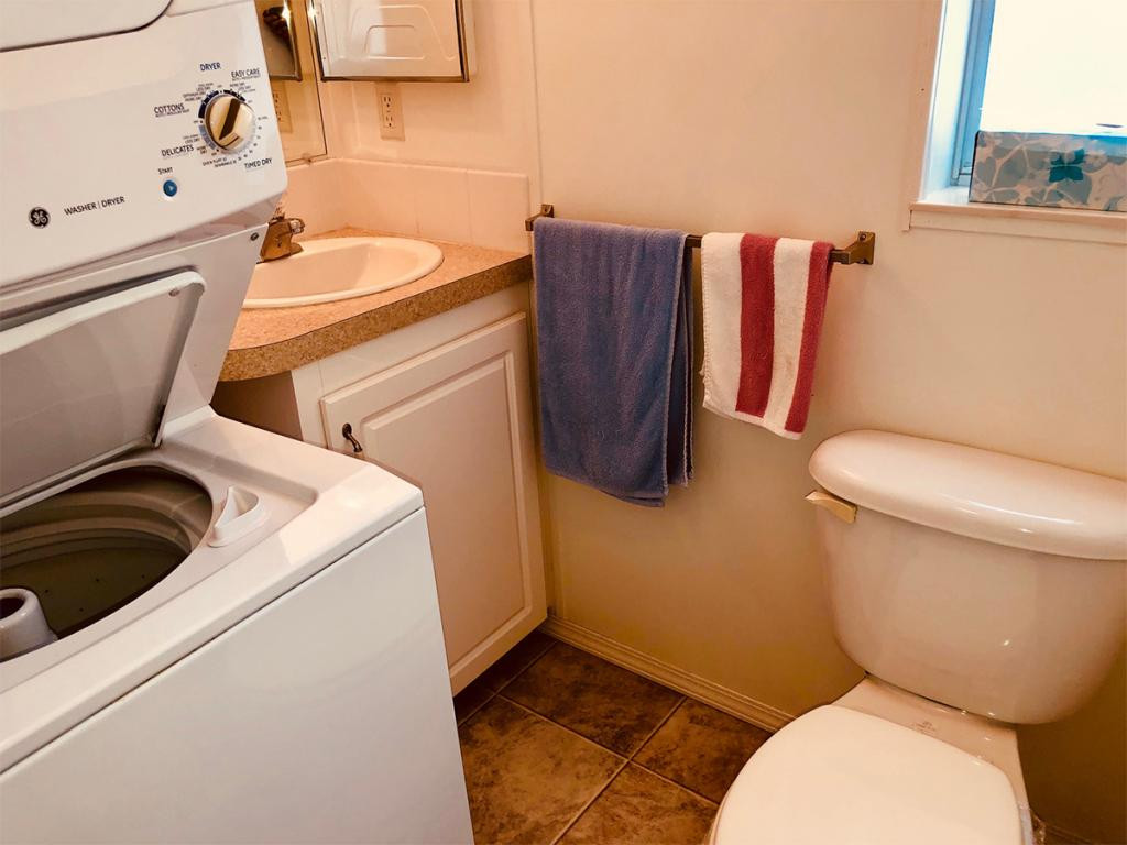 57 Temple Lane Naples, FL 34114 - Photo 17 of 18 a bathroom with a toilet and a sink