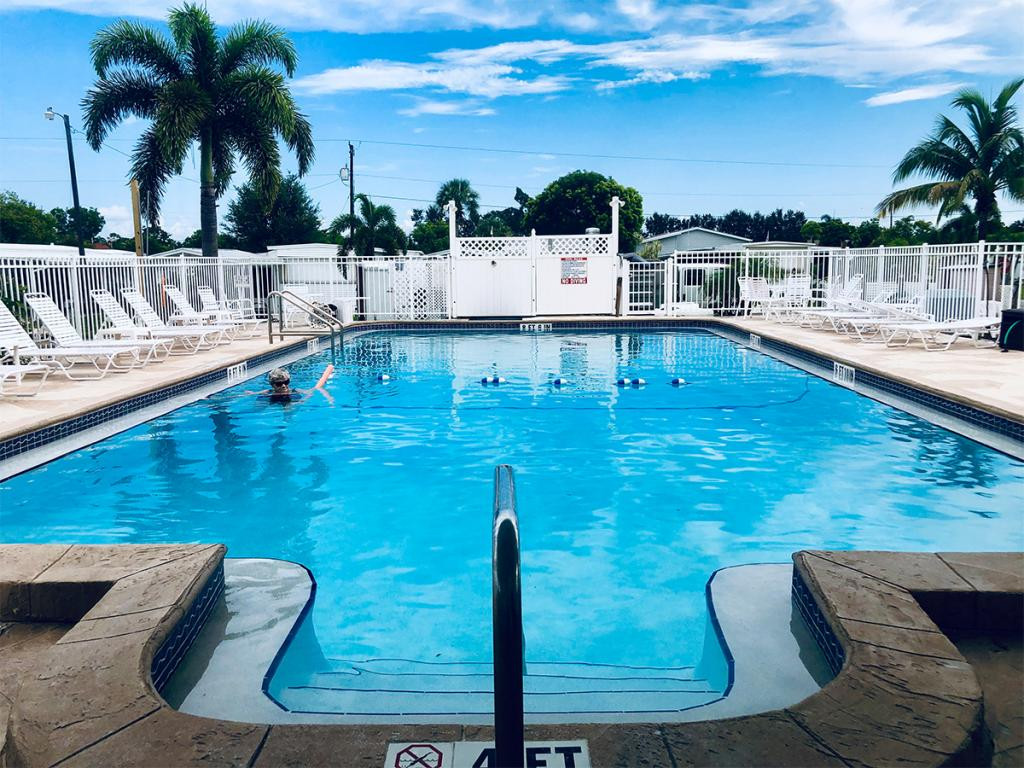 57 Temple Lane Naples, FL 34114 - Photo 3 of 18 a view of swimming pool with seating space