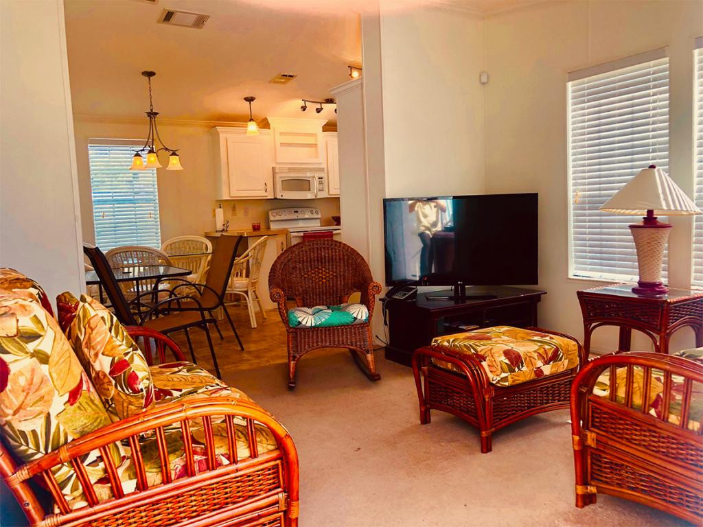 57 Temple Lane Naples, FL 34114 - Photo 5 of 18 a living room with furniture and a flat screen tv