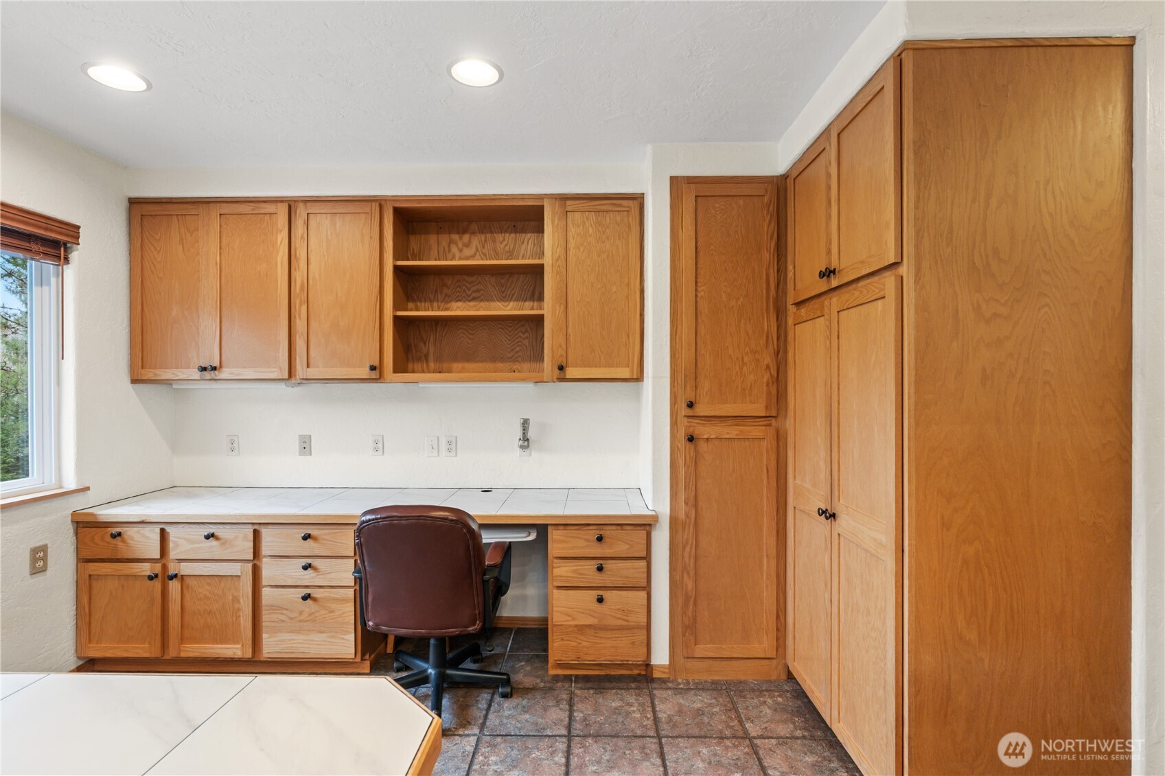 245 Joe Rocky Road Raymond, WA 98577 - Photo 12 of 40 a room with a chair and a refrigerator