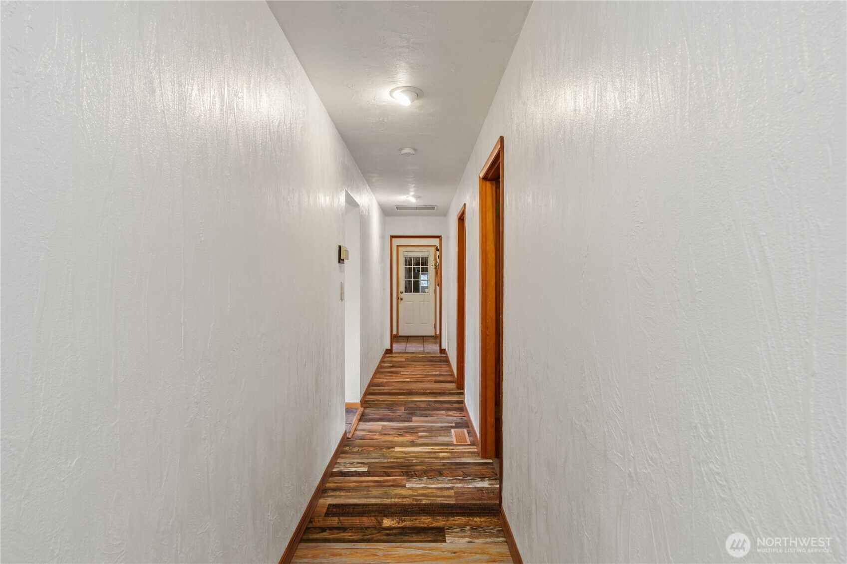 245 Joe Rocky Road Raymond, WA 98577 - Photo 17 of 40 a view of a hallway with wooden floor and entryway