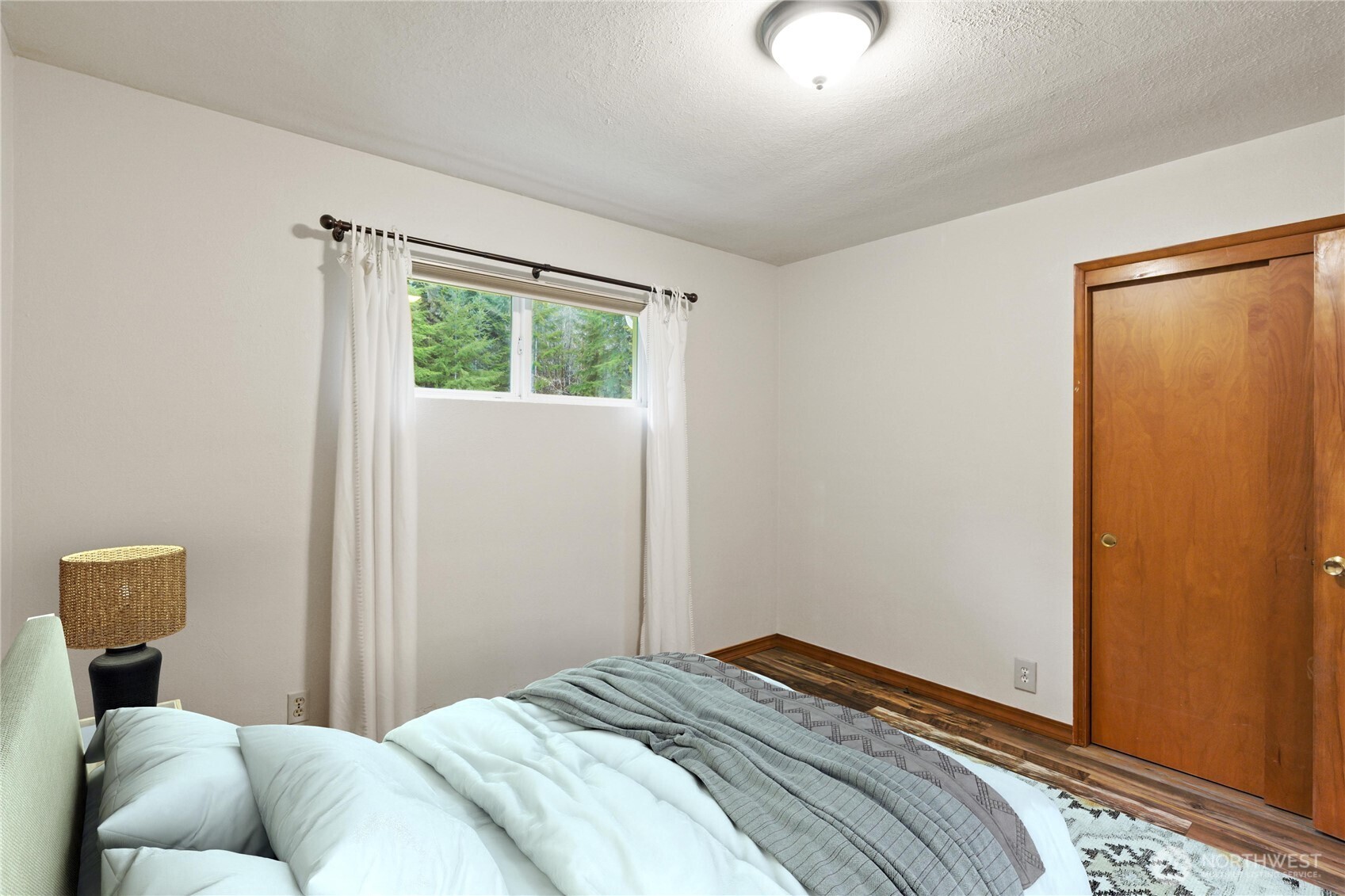 245 Joe Rocky Road Raymond, WA 98577 - Photo 19 of 40 a bedroom with a bed and a window