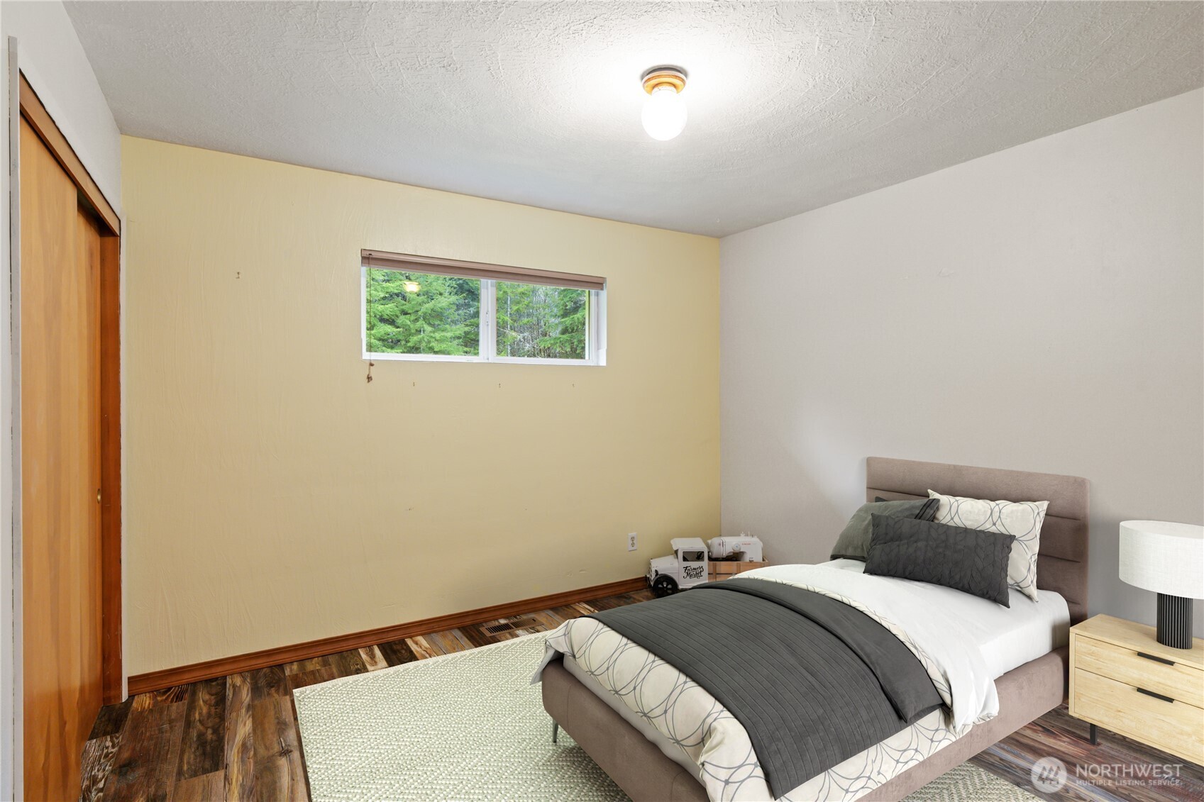 245 Joe Rocky Road Raymond, WA 98577 - Photo 22 of 40 a bedroom with a bed and a window